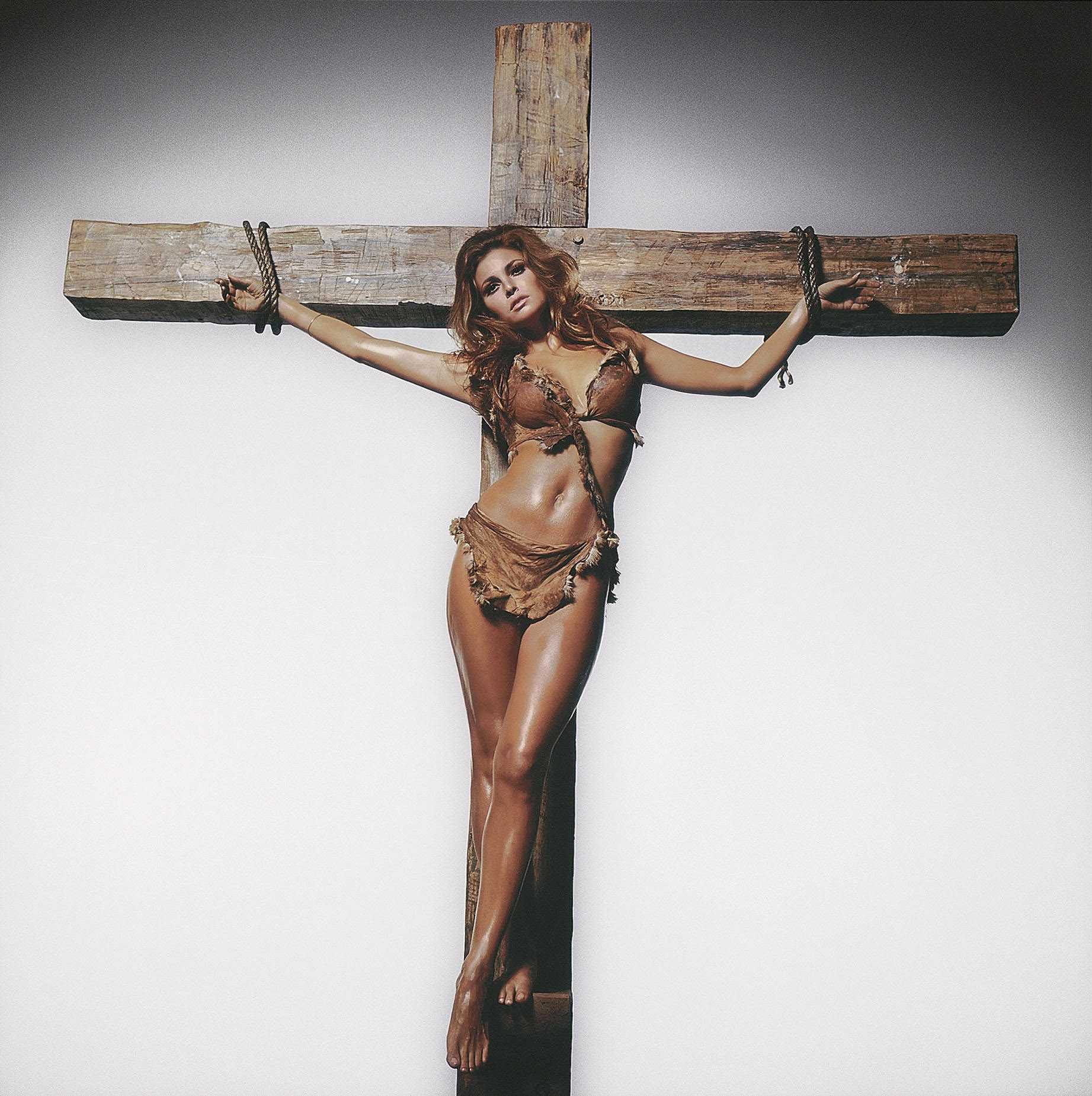 Terry O’Neill, Raquel Welch on the Cross, for Esquire Magazine
